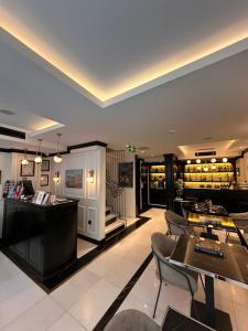 a restaurant with a bar and some chairs and tables at The Trinity Hotel Taksim - Special Category in Istanbul