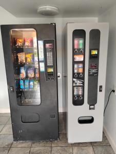 two vending machines are sitting next to each other at Gated 2 Double Beds Studio with Full Kitchen 134 in Baton Rouge