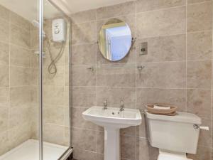 a bathroom with a toilet and a sink and a shower at 4 Bed in Bishop Auckland oc-93527 in Wear Head +21 photos