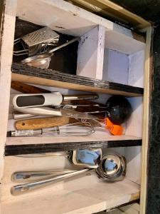 a drawer filled with lots of different types of tools at Himora in Gupta Kāshi +12 photos
