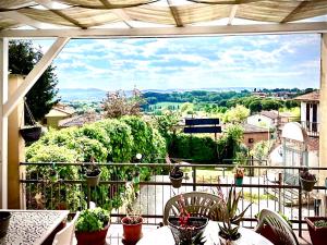 a balcony with a view of a city at Boutique Hotel L'Imperatrice -Vicinissimi a Valdichiana Designer Village- in Foiano della Chiana