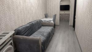a living room with a couch and a table at Apartment in Lankaran in Lankaran