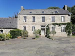 a large stone house with a large driveway at Fleur de Lys - Free wi-fi & parking in La Haye