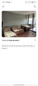 a living room with a couch and a table at Bruno in São José de Ribamar