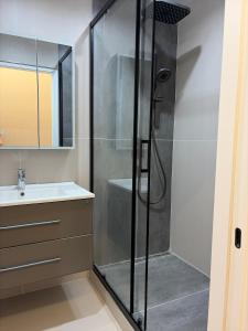 a bathroom with a shower and a sink at Jamshed apartment in Samarkand