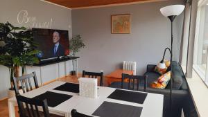 a living room with a table and a couch at Fjord Guesthouse in Súðavík