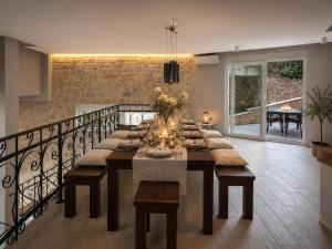 a dining room with a long table and a staircase at Villa Jasmin Posedarje in Posedarje