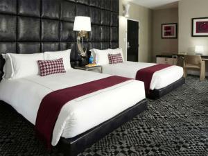 a hotel room with two beds in a room at Hotel Clark in Los Angeles +17 photos