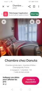 a screenshot of a website of a bedroom with a bed at Chambre chez Danuta in Champagnole