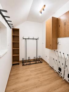 an empty room with white walls and wood floors at Chalupa pod Špičákem in Smržovka