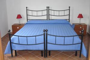 מיטה או מיטות בחדר ב-Agriturismo Arena Del Sol