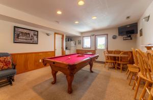 a living room with a pool table in it at Fun 'N Sun - Nags Head MP 16, 250 Ft to Beach Access, Pool, Pets OK, YR Flex Stays in Nags Head