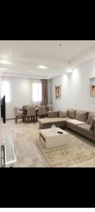 a living room with a couch and a table at Dar Haroun Tunis in Tunis +8 photos