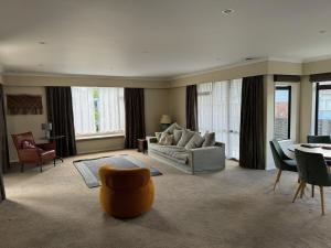 a living room with a couch and a table at Duke St Townhouse in Cambridge