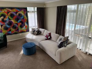 a living room with a couch with pillows on it at Duke St Townhouse in Cambridge