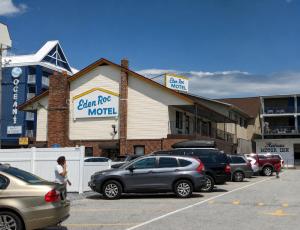 a parking lot with cars parked in front of a motel at Eden Roc Downtown in Ocean City