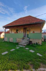 a small house with a green at Mera Small House in Mera