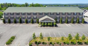 an aerial view of a large building with a parking lot at Stone Park Ellsworth-Bar Harbor in Ellsworth