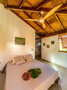 a bedroom with a large bed with a wooden ceiling at Bohème Chic, 2 Suites, Terrasse XXL in Le Gosier
