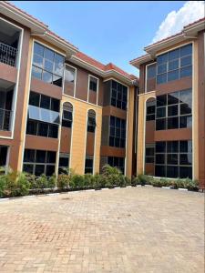 a large building with a lot of windows at Luxury Ntinda Apartment with Wi Fi and Netflix in Kampala
