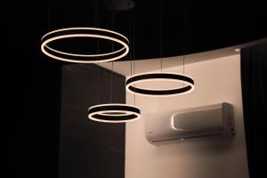 a couple of lights hanging from a ceiling at 115 Luxury Suite - Privitera in Grammichele