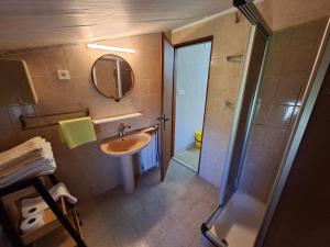 a bathroom with a shower and a sink and a mirror at MIRKO DIVING CENTER in Rab +117 photos