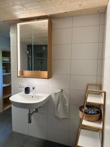a bathroom with a sink and a mirror at Rosenhaus 3 in Schwarzenberg +55 photos