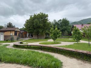 a house with a walkway in a residential neighborhood at Ala-Archa Mountain House in Vorontsovskoye