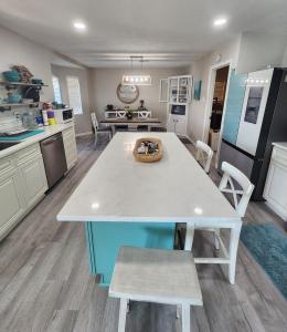a kitchen with a table with a cake on it at H20 paradise in Texas City