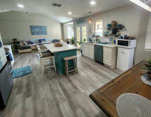 a kitchen and living room with a table in it at H20 paradise in Texas City +18 photos