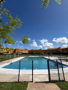a swimming pool in front of a building at Galia costa ballena 2 in Cádiz