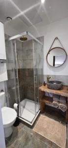 a bathroom with a shower and a toilet and a sink at Studio Mazalys-Entre Mer et Campagne in Crépon