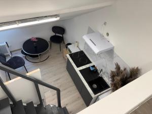 an overhead view of a living room with a stove at Studio in Geraardsbergen +7 photos