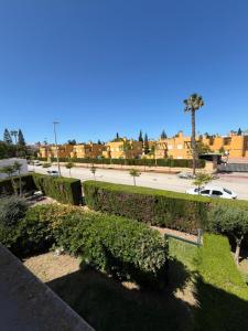 a view of a park with bushes and a street at Galia costa ballena 2 in Cádiz