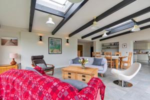 a living room with a couch and chairs and a table at Finest Retreats - Yonder Castle Hill in Harley