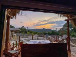 a view from the window of a room with a bed at Seúl Haus in El Sunzal