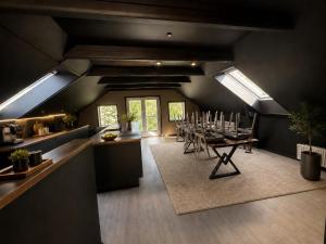 a room with a dining room with a table and skylights at 4SEASONS - Amber Spring Suite in Aalborg