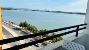 a view of a river from a balcony at Vieiras House Quarto Solteiro in Barreiro