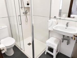 a bathroom with a shower and a toilet and a sink at Casa Rural Casole in Castalla +28 photos