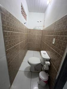 a bathroom with a toilet and a sink at Blue Day in Canoa Quebrada
