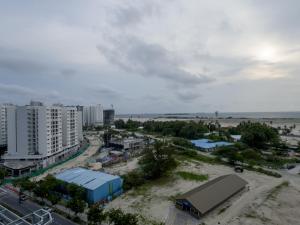 an aerial view of a city with a beach and buildings at Araam Retreat Deluxe in Male City
