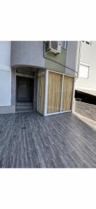 an empty parking lot of a building with a door at Bluxury in Kumanovo