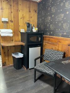 a dining room with a table and a microwave at The Spruce Lodge in South Fork