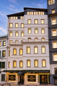 a large white building with many windows at Bond Hotel in Istanbul