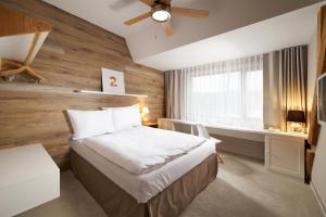 Posteľ alebo postele v izbe v ubytovaní Cihelny Golf & Wellness Resort