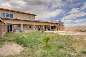a house with a yard and a swimming pool at Golf, Lakes & Trails! Truth Or Consequences Home in Truth or Consequences