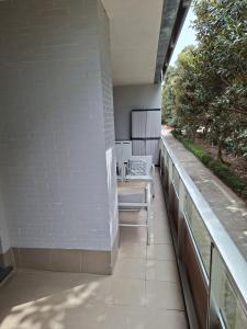 a balcony with a bench on the side of a building at La casa en la playa in Rota