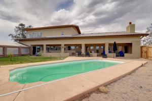 a house with a swimming pool in front of it at Golf, Lakes & Trails! Truth Or Consequences Home in Truth or Consequences