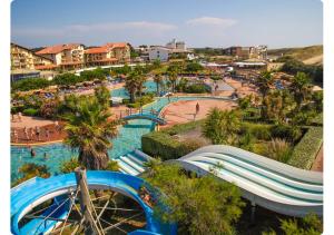 a resort with a water park with a roller coaster at Maison de Charme,Plage et Forêt, 6 personnes in Seignosse