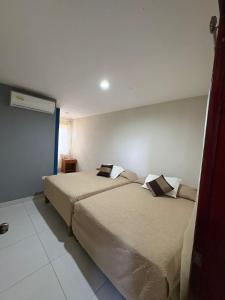 a hotel room with two beds in a room at Portal de José - Hotel Boutique in Ciudad Valles